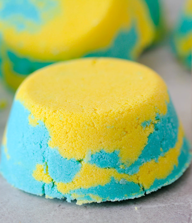 Lemon-Lime Bath Bombs are an invigorating blend of lime and lemon essential oil to make an all-natural refreshing bath bomb.  