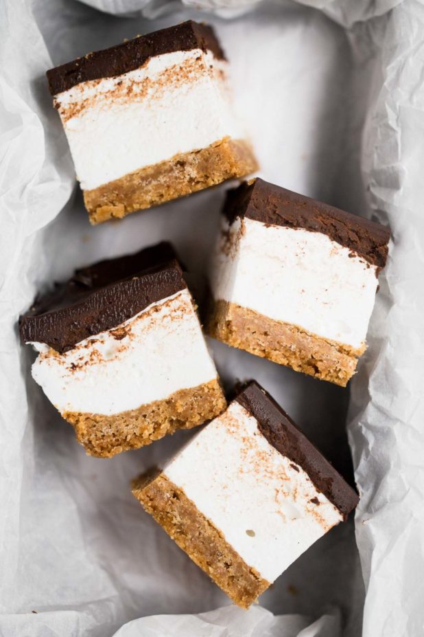 These s’mores bars sandwich a thick layer of fluffy homemade vanilla bean marshmallow in between graham cracker crust & salted dark chocolate ganache.