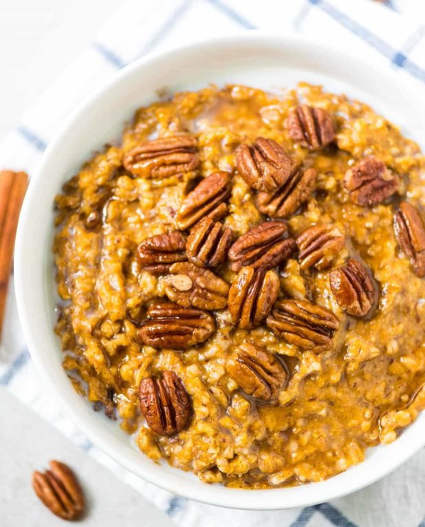 Easy, healthy steel cut oats, made in the slow cooker while you sleep! With pumpkin, cinnamon, and maple syrup.